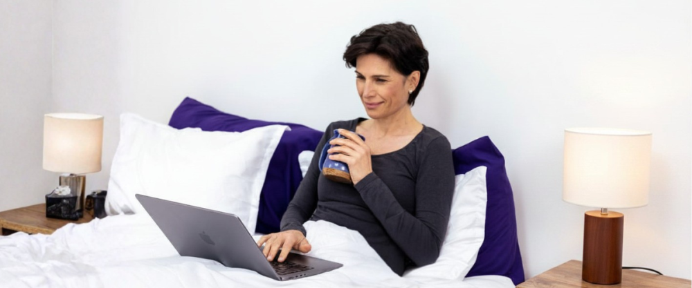How to Tell If You Have Sleep Apnea Woman on her computer researching information about sleep apnea symptoms