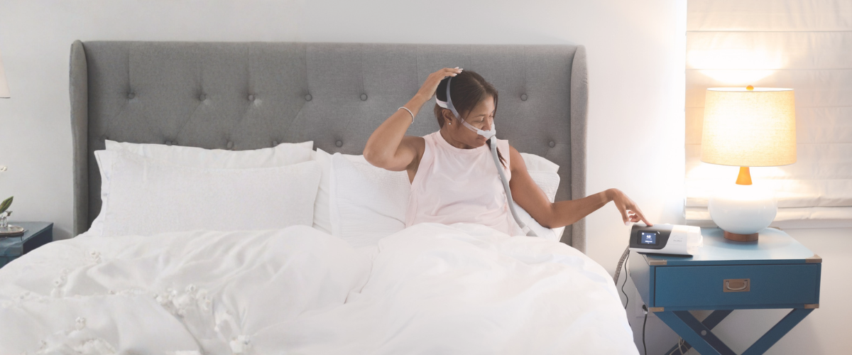 Why Pressure Settings Are Required for APAP Machines CPAP user in bed turning on an APAP machine to treat sleep apnea
