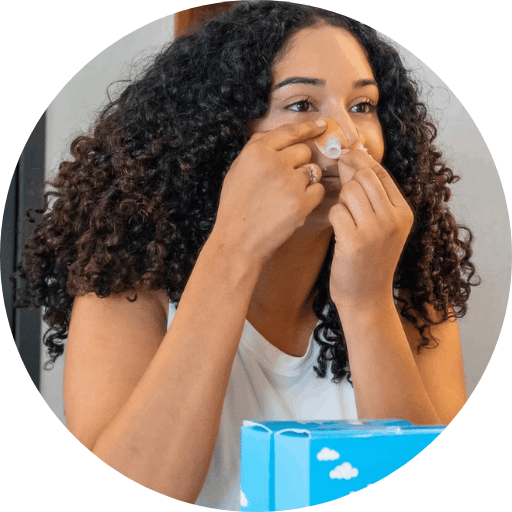woman putting on the specialty cpap mask of Bleep brand