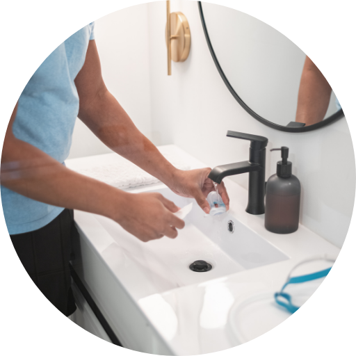 person hand-washing their CPAP mask cushion