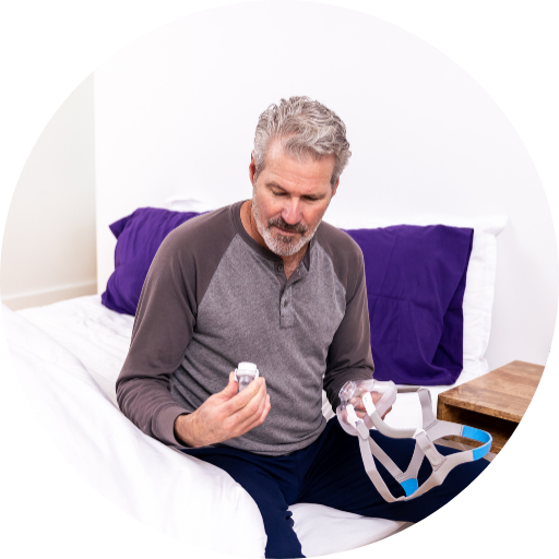 person inspecting the individual cpap masks and supplies