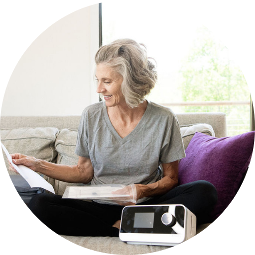 woman reading about a cpap machine for her sleep apnea treatment