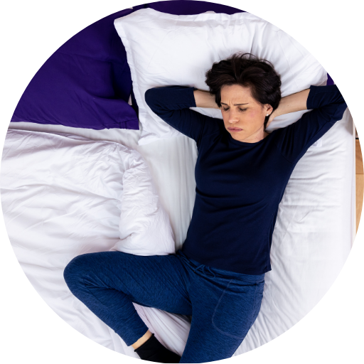 woman struggling to sleep due to night sweats from her sleep apnea