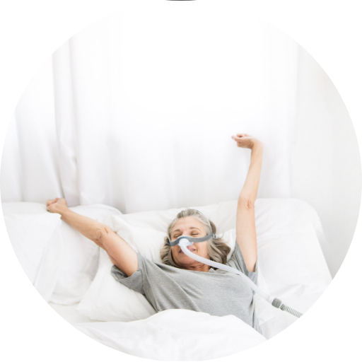 man adjusting his cpap machine while wearing a full face cpap mask